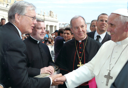 CATHOLIC CONFERENCE – Jim Cunningham, executive director of the Nebraska Catholic Conference, was part of a pilgrimage to Rome last October with almost two dozen state Catholic conference directors from around the U.S.  As the longest-tenured state conference director, he was chosen by the association’s executive committee to represent the group in meeting Pope Francis at his Wednesday general audience at St. Peter’s. Also pictured with the Holy Father and Cunningham are Bishop Joseph C. Bambera of Scranton. Penn., and Scranton vicar general Father Thomas Muldowney.  (Courtesy photo)